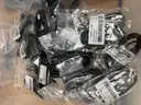 A Package of New iPhone Covers, Cases, Wall Charge Adapters, USB Cables