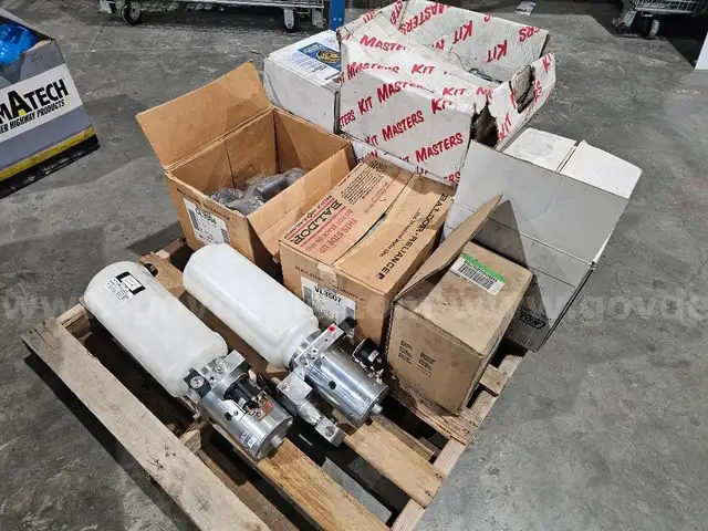 Pallet of new old stock fire truck parts power steering reservoirs, fan clutch kits, Cummins water pump, etc.