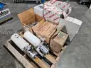 Pallet of new old stock fire truck parts power steering reservoirs, fan clutch kits, Cummins water pump, etc.