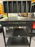 Lot of Die Cut Machines, Assorted Dies, Storage Racks, &#x26; Cutting Table