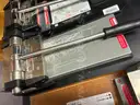 Lot of Die Cut Machines, Assorted Dies, Storage Racks, &#x26; Cutting Table