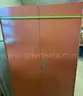 Rolling metal cabinet. About 65&#x22; tall, 26&#x22; deep, and 37&#x22; wide.