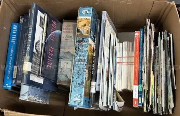 Two boxes of books and maps from Social Studies Classroom