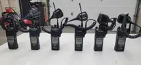 6 Motorola XTS 5000 Portable Radios and Six Bank Charger Station