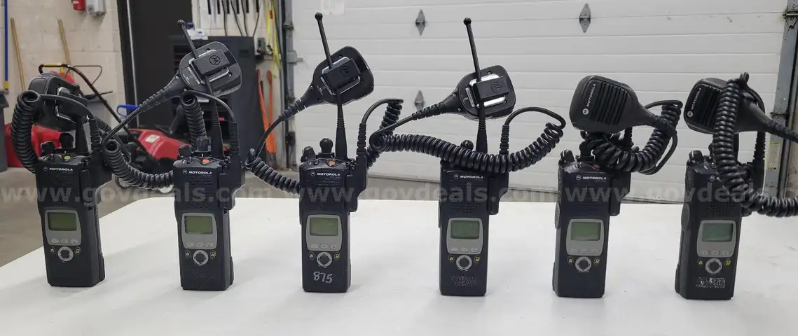6 Motorola XTS 5000 Portable Radios and Six Bank Charger Station