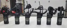 6 Motorola XTS 5000 Portable Radios and Six Bank Charger Station