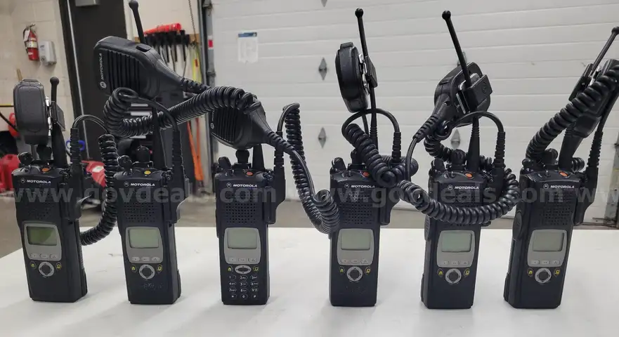 6 Motorola XTS 5000 Portable Radios and Six Bank Charger Station