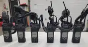 6 Motorola XTS 5000 Portable Radios and Six Bank Charger Station