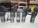 5 Motorola XTL 5000 Mobile Radios and 6 bank charging station