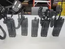5 Motorola XTL 5000 Mobile Radios and 6 bank charging station