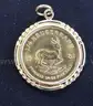 1981- 1/4 Ounce Krugerrand In 14K Yellow Gold Bezel, 11.6 Grams