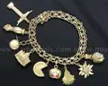 14k Yellow Gold Charm Bracelet with 9- 18k and 14k Charms, 49.5 Grams
