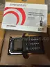 Fifteen Harris Momentum UHF Two Way Radios in the Box