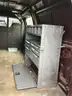 Ford E250 cargo van with ladder rack