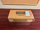 1 Lot of 100 Unopened MSA UltraElite APR/CBRN Respirator Facepiece w/Rubber Head Harness (Medium)