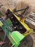 Yellow John Deere Rototiller