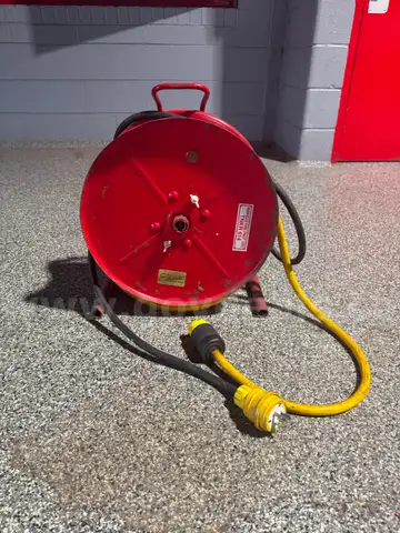 Two reels, 20a, 125v, 10-3 electric cords with NEMA Twist-lock plugs