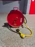 Two reels, 20a, 125v, 10-3 electric cords with NEMA Twist-lock plugs