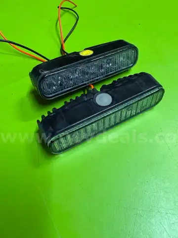 PAIR OF AMBER YELLOW WHELEN UNIVERSAL IONS WITH GROMMETS - SHIPPING ONLY - MA