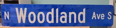 Aluminum Street Sign N WOODLAND AVE S