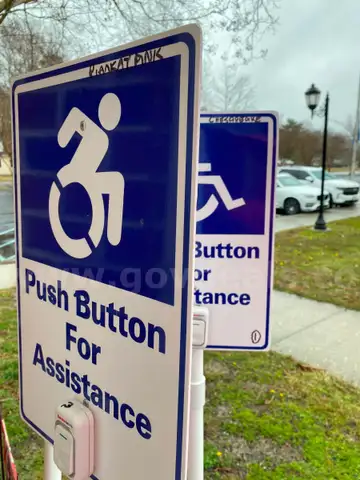 Battery operated door bell on portable base assists voters for entering voting precinc