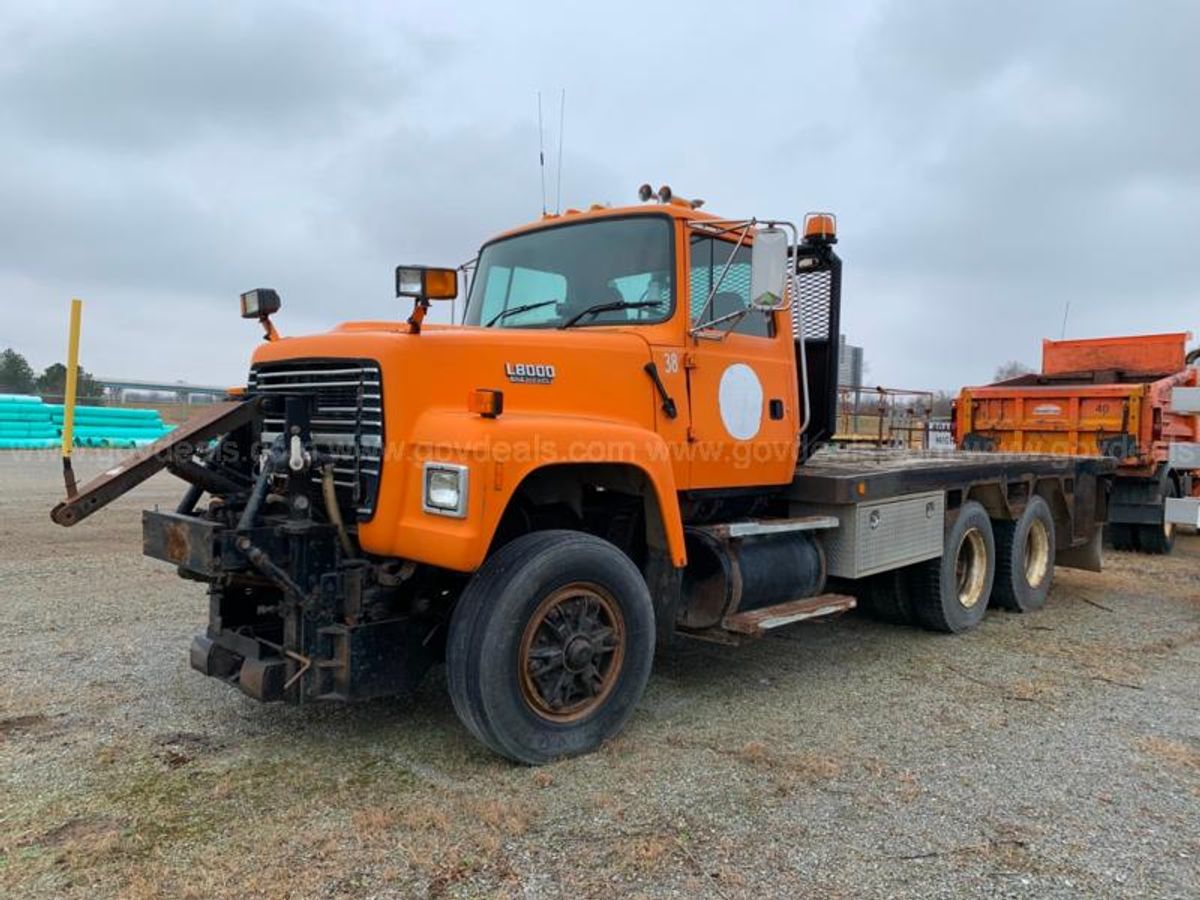 1995 Ford LT8000F - Tandem Axle Flat Bed Truck | AllSurplus