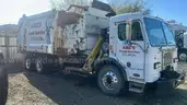 2013 Peterbilt 320 Side Load Garbage Truck