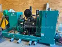 Cummins 100 kW standby generator powered by a Ford 6.8L V10 gas engine.