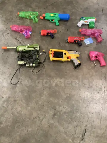 Lot of misc box items-two red XShot toy guns, yellow Nerf toy gun, 3 pink plastic toy guns, green &#x26; white X toy gun &#x22;DH&#x22;