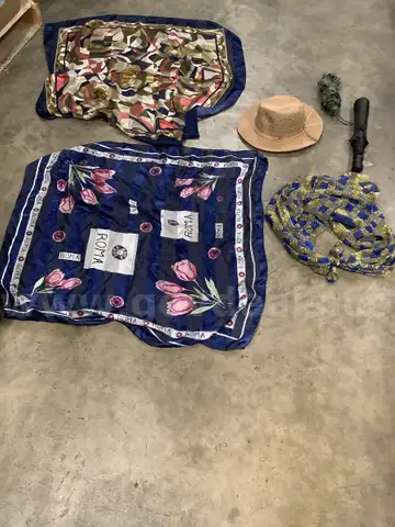 Lot of misc box items-35 inch &#x22;Roma&#x22; table cloth, &#x22;one fits all&#x22; light brown hat, blue mixed w green design scarf, &#x22;DH&#x22;