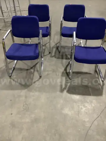4 dark blue chairs, with steel silver armrests  &#x22;DH&#x22;