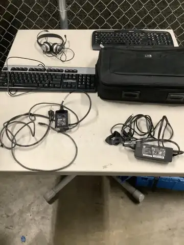 Lot of misc box items-17 inch HP laptop bag, HP, &#x26; Logitech keyboards, 2 HP adapters, office headset, &#x22;DH&#x22;