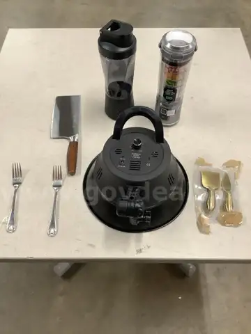 Lot of misc box items-2 blenders, 2 gold cheese knives, cleaver butcher knife, Promaster lid, 2 silver forks, &#x22;DH&#x22;