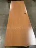 78 x 24 brown rectangle table, with two black leg stands  &#x22;DH&#x22;