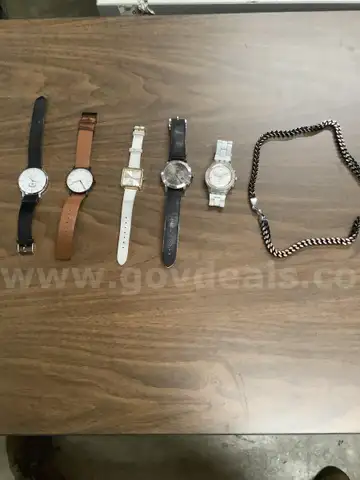 Lot of misc box items-Brown leather Skagen watch, white leather Nine West watch, Burberry watch, Swatch watch,  &#x22;DH&#x22;