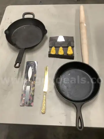 Lot of misc box items-11 inch Bobby Flay pan, 9 1/2 inch Lodge pan, 3 Holland cheese knives, gold kitchen knife, &#x22;DH&#x22;