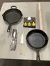 Lot of misc box items-11 inch Bobby Flay pan, 9 1/2 inch Lodge pan, 3 Holland cheese knives, gold kitchen knife, &#x22;DH&#x22;