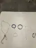 Lot of misc box items-Blue rocks wrist band, gold silver diamond wrist band, silver Dinosaur necklace,  &#x22;DH&#x22;