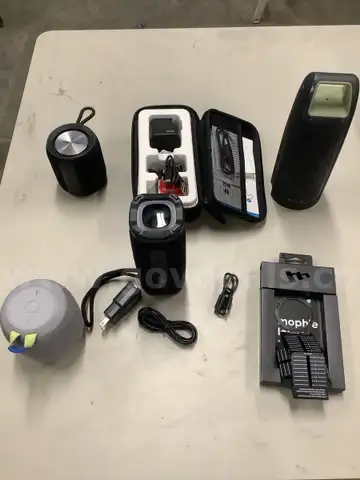 Lot of misc box items-Neza wireless speaker, Kicker bluetooth speaker, Matune speaker, Mophine span adapter,  &#x22;DH&#x22;