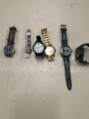 Lot of misc box items-Timex watch, gold Guess watch, Quartz watch, Benyar watch, Casio watch,  &#x22;DH&#x22;