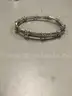 Lot of misc box items-Silver ring, gold roman numerals wrist band, &#x22;L&#x22; diamond piece,  &#x22;DH&#x22;