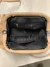 Lot of misc box items-Light brown leather purse, clear black purse, with an attached chain, pink Kipling bag,  &#x22;DH&#x22;