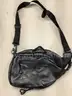 Lot of misc box items-Light brown leather purse, clear black purse, with an attached chain, pink Kipling bag,  &#x22;DH&#x22;