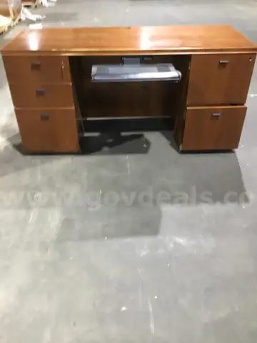 60 (L) x 24 (W) x 28 (H) dark brown five drawer executive desk, two key locks, middle black tray opener  “DH”