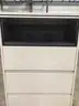 36 (L) x 20 (W) x 54 1/2 (H) tan four drawer metal filing cabinets, with brackets (NO KEY LOCKS)  “DH”