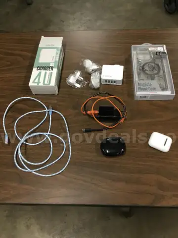 Lot of misc box items-white FDTEK charger, clear phone case, Elta usb port outlet, white &#x26; black earplugs  &#x201C;DH&#x201D;