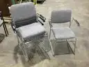 Six Metal Frame Stackable Chairs w/charcoal gray seating                                                           “C”