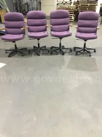 4 purple adjustable chairs, with brown hardwood armrests  “DH”