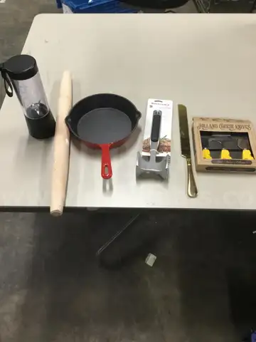 Lot of misc box items-8 inch red Utopia steel pan, meat tenderizer, black portable blender, light oak rolling pin  “DH”