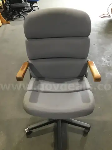 Teal gray adjustable chair; light brown hardwood armrests  “DH”